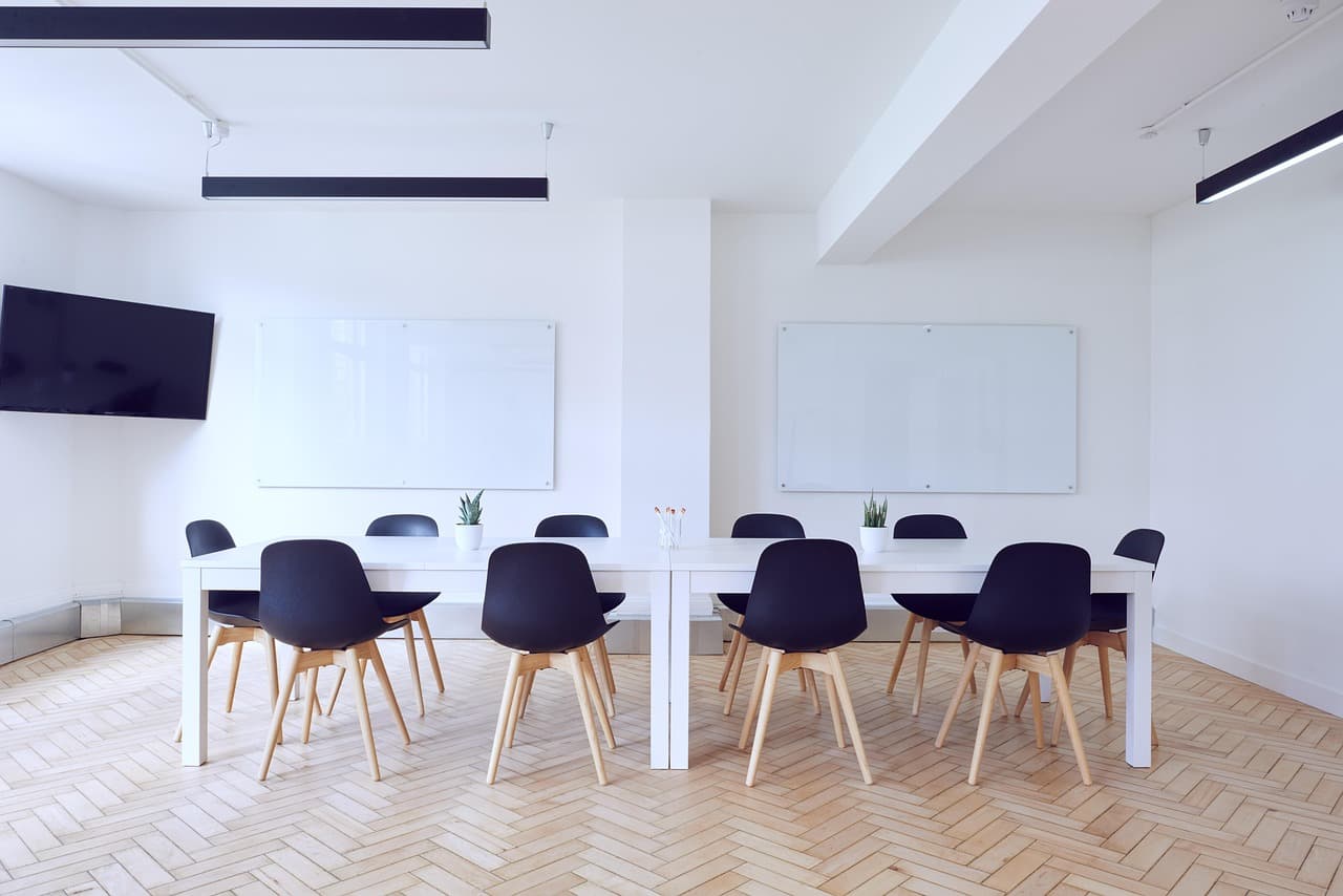 Empty conference room with rows of chairs prepared for a leadership event
